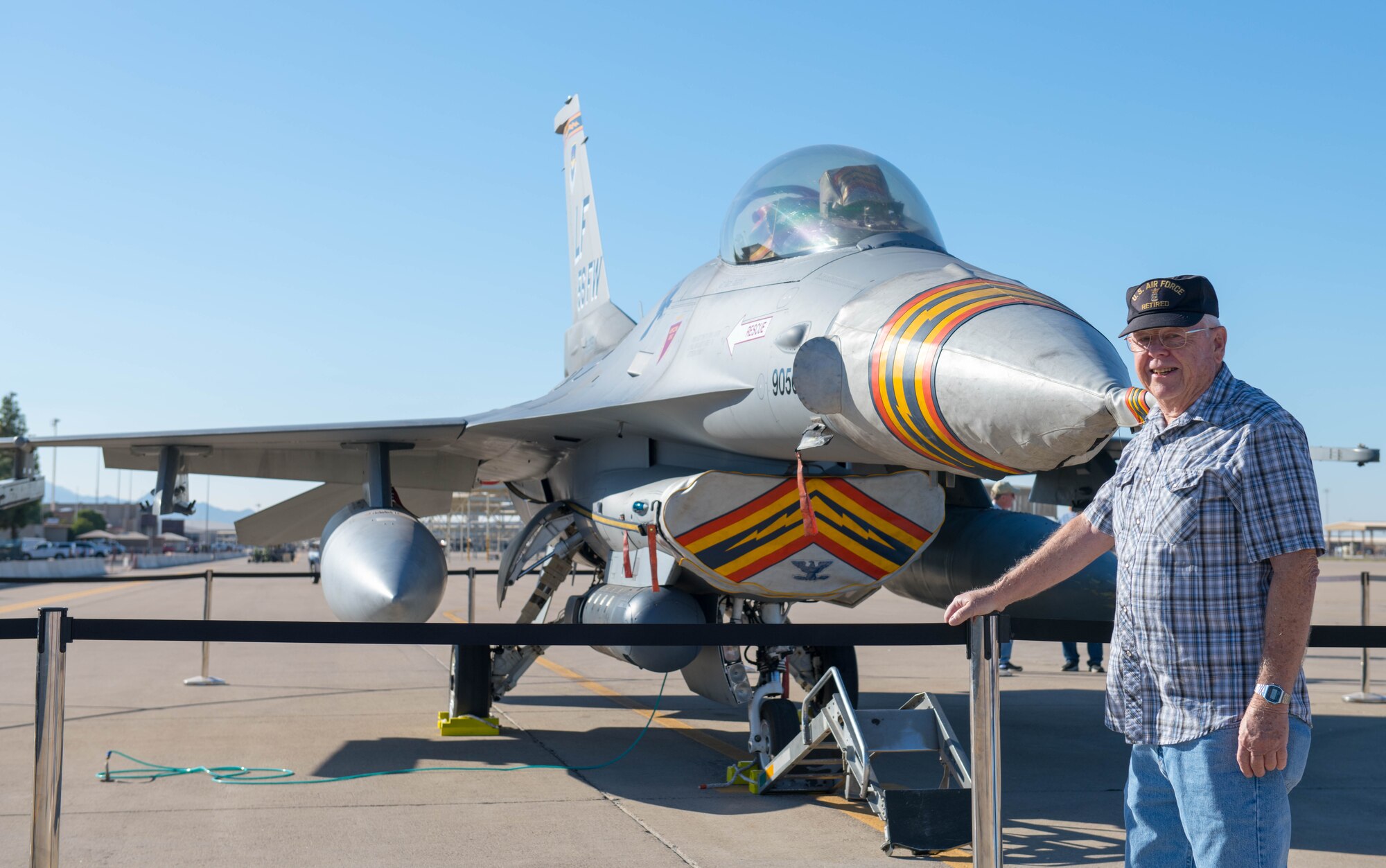 im Ritenour, retired Air Force member, poses in front of an F-16C Fighting Falcon during Retiree Appreciation Day (RAD), Oct. 26, 2019, at Luke Air Force Base, Ariz.