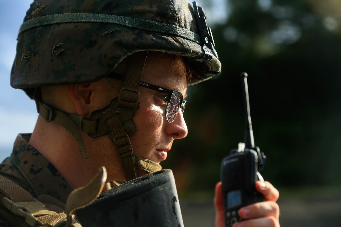 U.S. Marine Corps Cpl. William Testorff with Headquarters Battalion, 3rd Marine Division, performs a radio check while on patrol during Samurai 20-1 on Camp Hansen, Okinawa, Japan, Oct. 22, 2019. The purpose of this exercise is to conduct battle drills that validate the 3rd Marine Division’s movement, setup of a combat operations center, force protection, and passage of command and control between supporting elements. (U.S. Marine Corps photo by Sgt. David Staten)