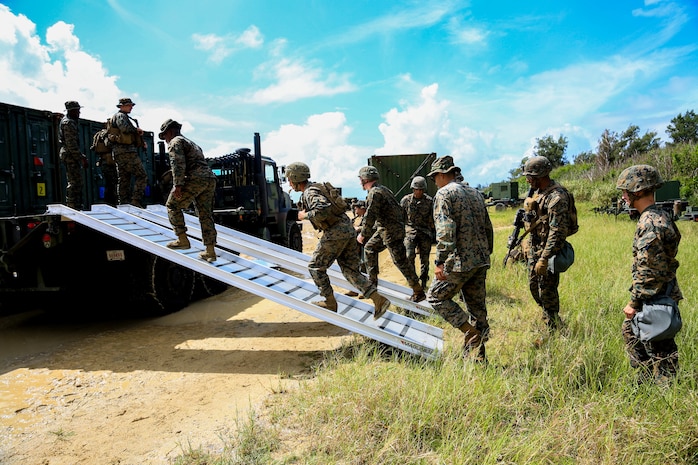 U.S. Marines with Headquarters Battalion, 3rd Marine Division, begin to offload a 7-ton vehicle during Samurai 20-1 on Camp Hansen, Okinawa, Japan, Oct. 22, 2019. The purpose of this exercise is to conduct battle drills that validate the 3rd Marine Division’s movement, setup of a combat operations center, force protection, and passage of command and control between supporting elements. (U.S. Marine Corps photo by Sgt. David Staten)
