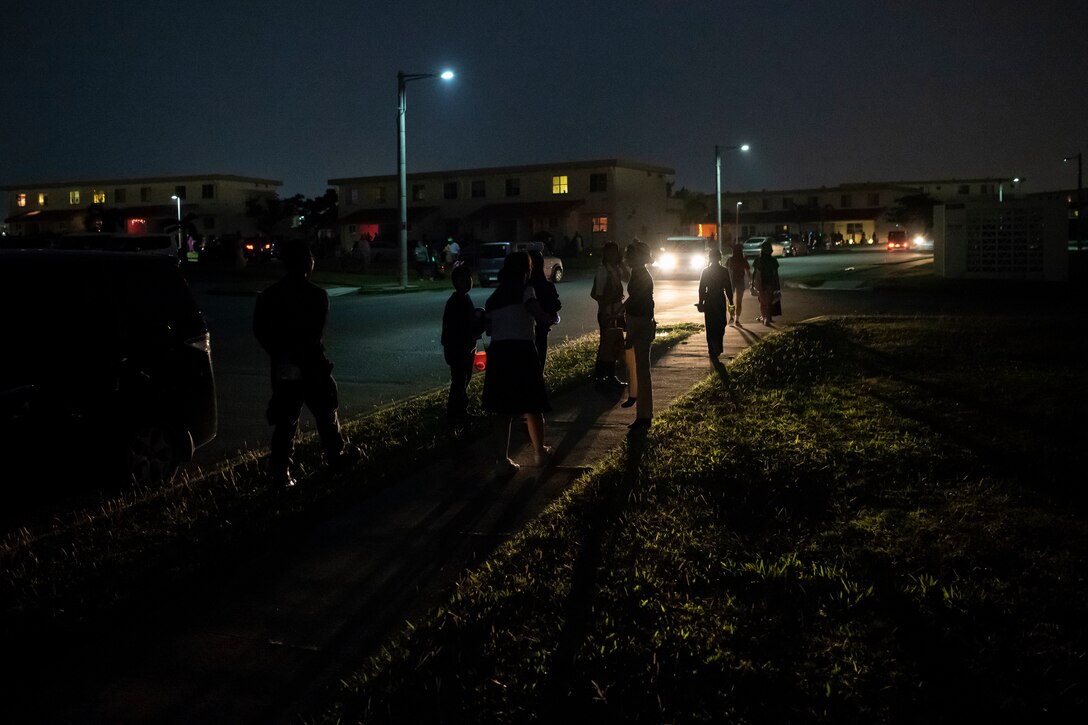 A group of Okinawan children walk from house-to-house during a Halloween trick-or-treat event Oct. 31, 2019, on Kadena Air Base, Japan. Japanese residents participated in a cultural exchange allowing a portion of local communities to experience trick-or-treating with service members and their families. (U.S. Air Force photo by Senior Airman Rhett Isbell)