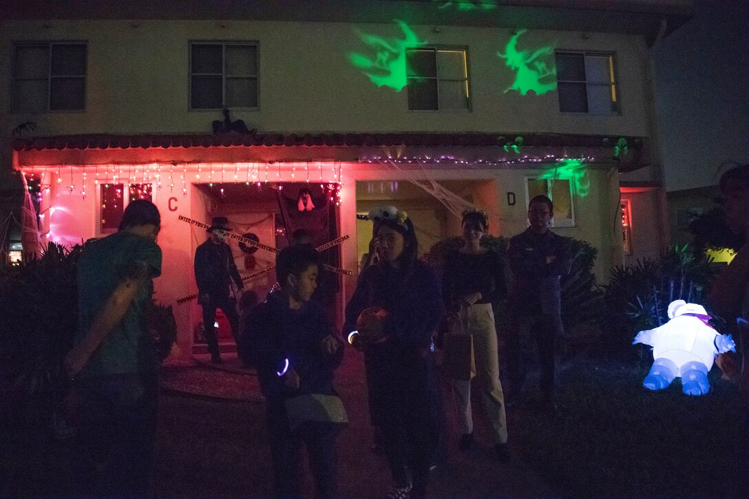 Children from Kadena Air Base, Japan, and Okinawa receive candy during a Halloween trick-or-treat event Oct. 31, 2019, on Kadena Air Base. The base opened its gates to a portion of the local community to share the traditional custom of trick-or-treating to enhance relations with host nation partners. (U.S. Air Force photo by Senior Airman Rhett Isbell)