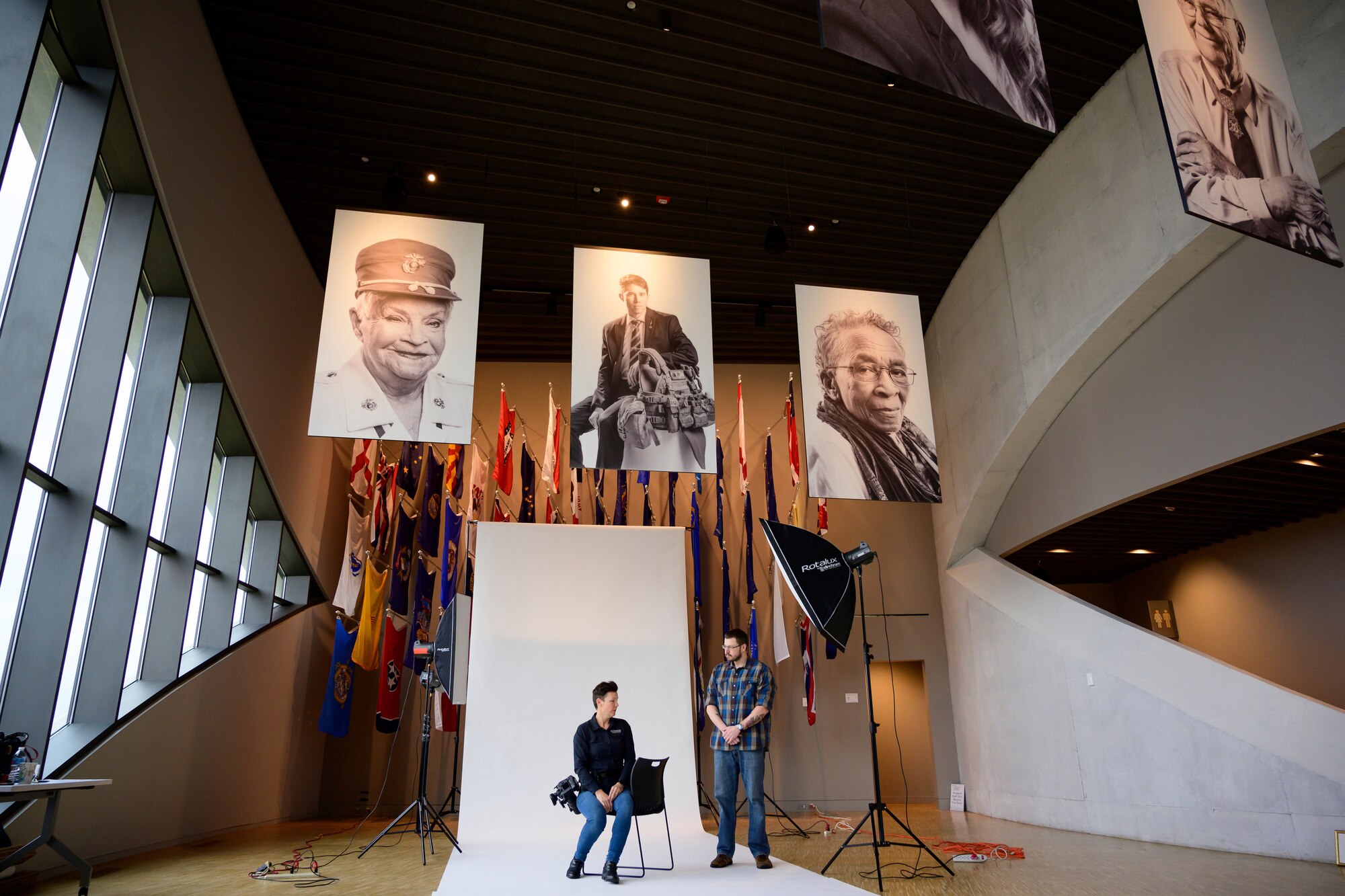 veterans portraits hanging in display above portable studio