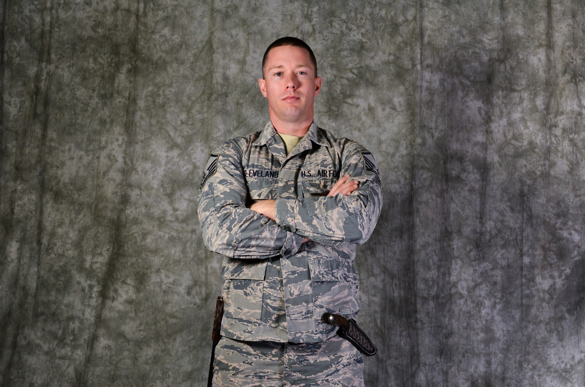 Master Sgt. Casey Cleveland, 507th Aircraft Maintenance Squadron maintenance supervisor, poses with his handmade blades Oct. 22, 2019, at Tinker Air Force Base, Oklahoma. Cleveland recently competed on the bladesmithing competition show Forged in Fire on the History Channel. (U.S. Air Force Photo by Senior Airman Mary Begy)