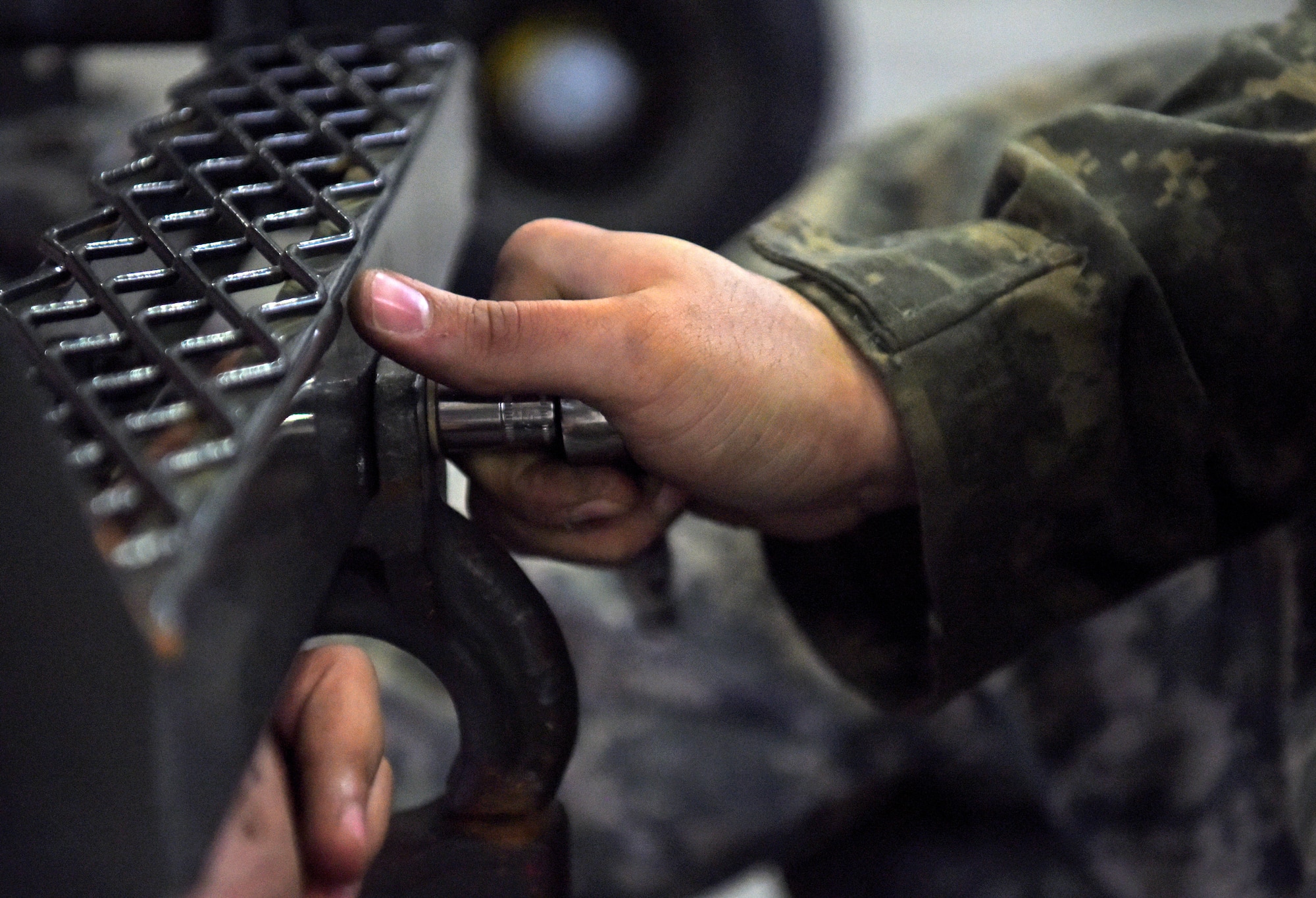 Airman 1st Class Thomas Goethe, 100th Maintenance Squadron aerospace ground equipment technician, repairs a bolt at RAF Mildenhall, England, Oct. 23, 2019. AGE Airmen repair equipment used by aircraft maintainers on the flightline. (U.S. Air Force photo by Senior Airman Brandon Esau)