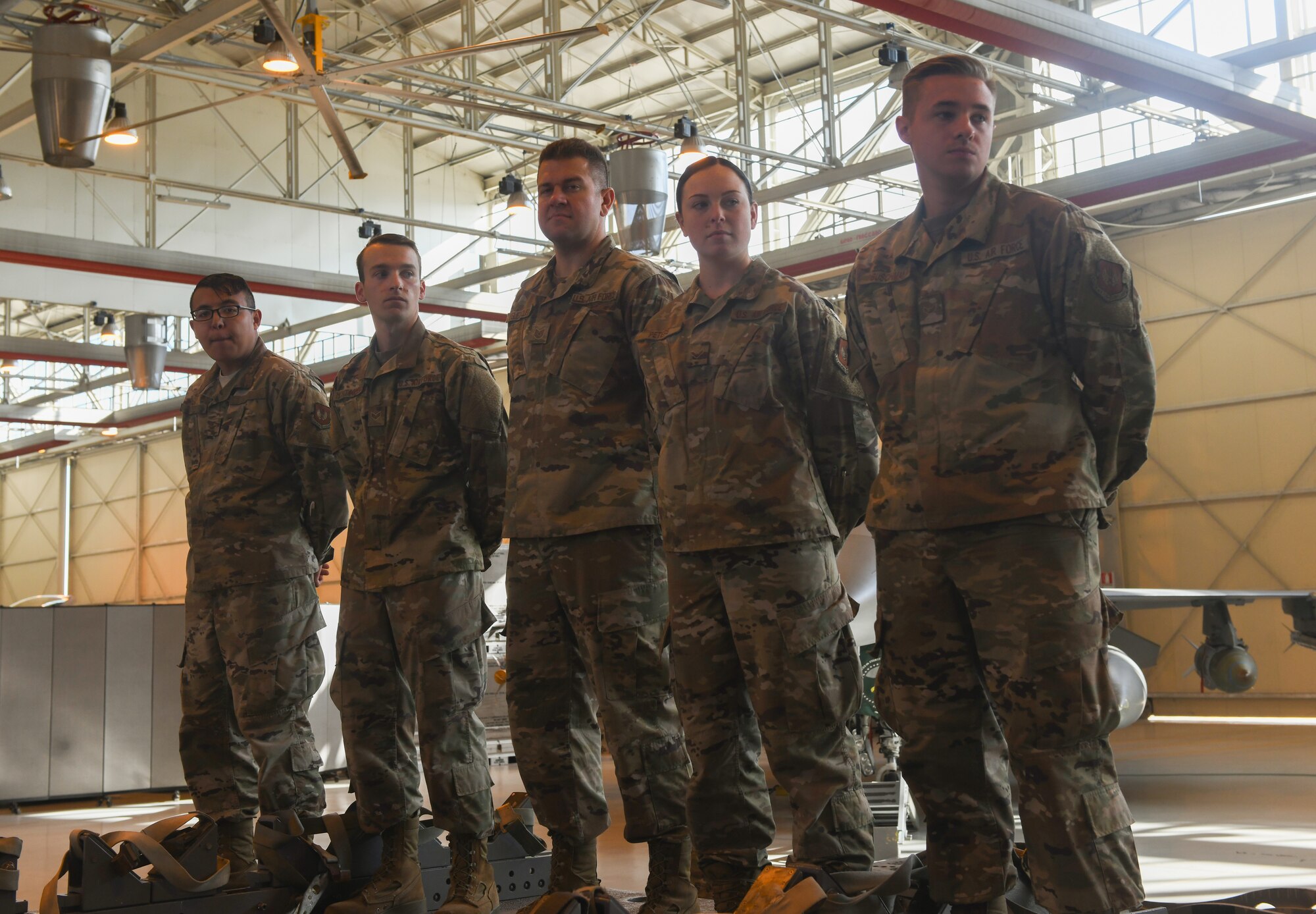 U.S Airmen from the 31st Munition Squadron stand on a trailer at Aviano Air Base, Italy, Oct. 31, 2019. The Rapid Aircraft Generation and Employment competition consisted of one seven-level Ammo, two Ammo five-levels, and two Ammo-three levels crew chiefs. (U.S. Air Force photo by Airman 1st Class Ericka A. Woolever).