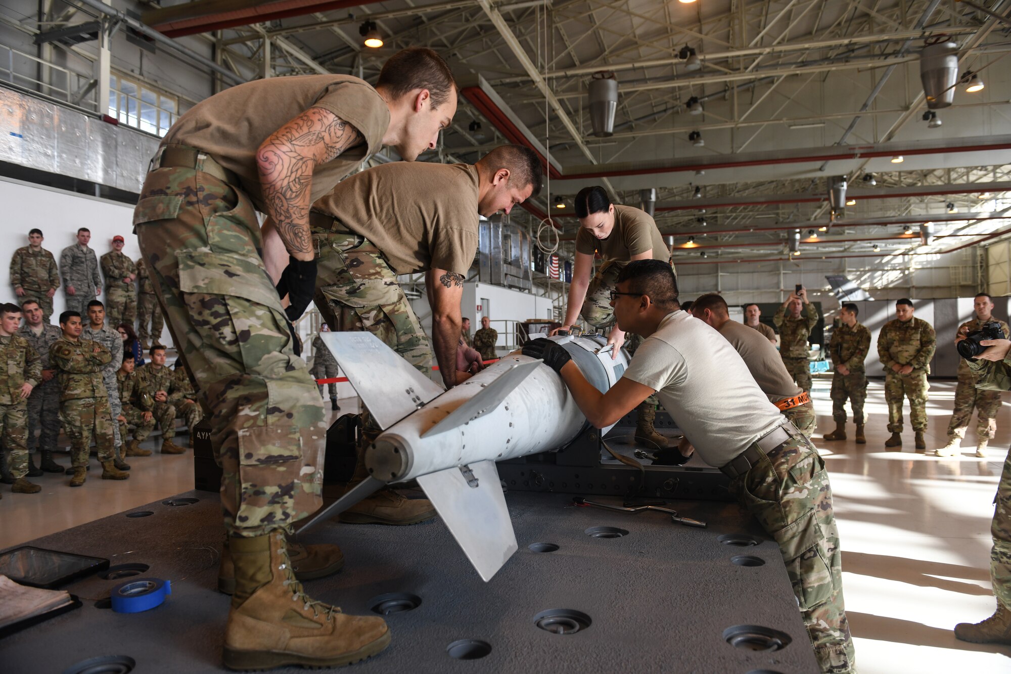 U.S Airmen from the 31st Munition Squadron conduct an inert bomb build at Aviano Air Base, Italy, Oct. 31, 2019. Two teams competed in the final event of Rapid Aircraft Generation and Employment competition. (U.S. Air Force photo by Airman 1st Class Ericka A. Woolever).