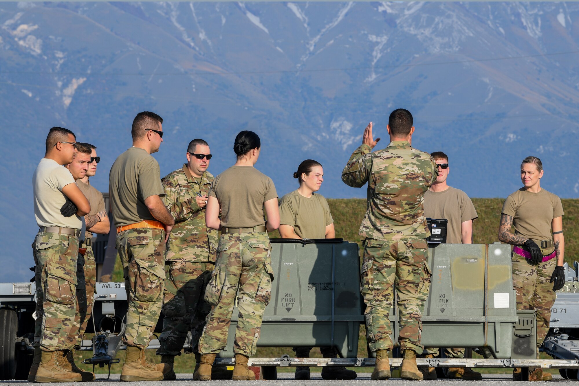 U.S Air Force Senior Master Sgt. Chet Reed, a production flight chief from the 31st Munition Squadron, briefs Airmen about the rules and engagement for the trailer configuration and trailer re-configuration at Aviano Air Base, Italy, Oct. 25, 2019. The competition consisted of six evaluated events, a written test, stockpile practices, trailer configuration, trailer re-configuration, 463L palletization and a weapons build.  (U.S. Air Force photo by Airman 1st Class Ericka A. Woolever).