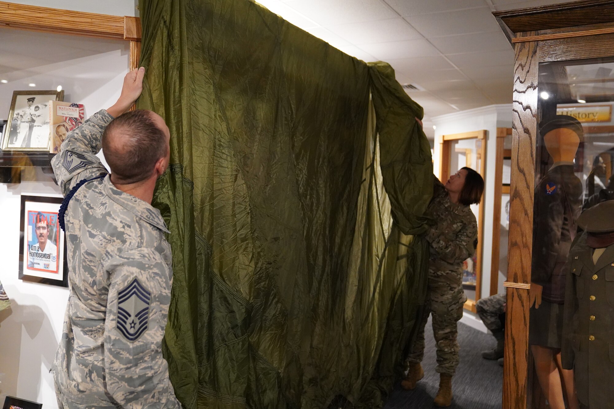 U.S Air Force Chief Master Sgt. Daniel Reed, Second Air Force military training instructor and military training leader career field manager, and Chief Master Sgt. JoAnne Bass, Second Air Force command chief, prepare to unveil the MTL wall at Maxwell Air Force Base Gunter Annex, Alabama, Oct. 30, 2019. MTLs play a vital role in the development of the next generation of Air Force leaders, warfighters, and protectors of freedom. The Air Force Enlisted Heritage Hall has dedicated a wall to highlight their lineage and contributions to the Air Force. (U.S Air Force photo by Airman 1st Class Spencer Tobler)