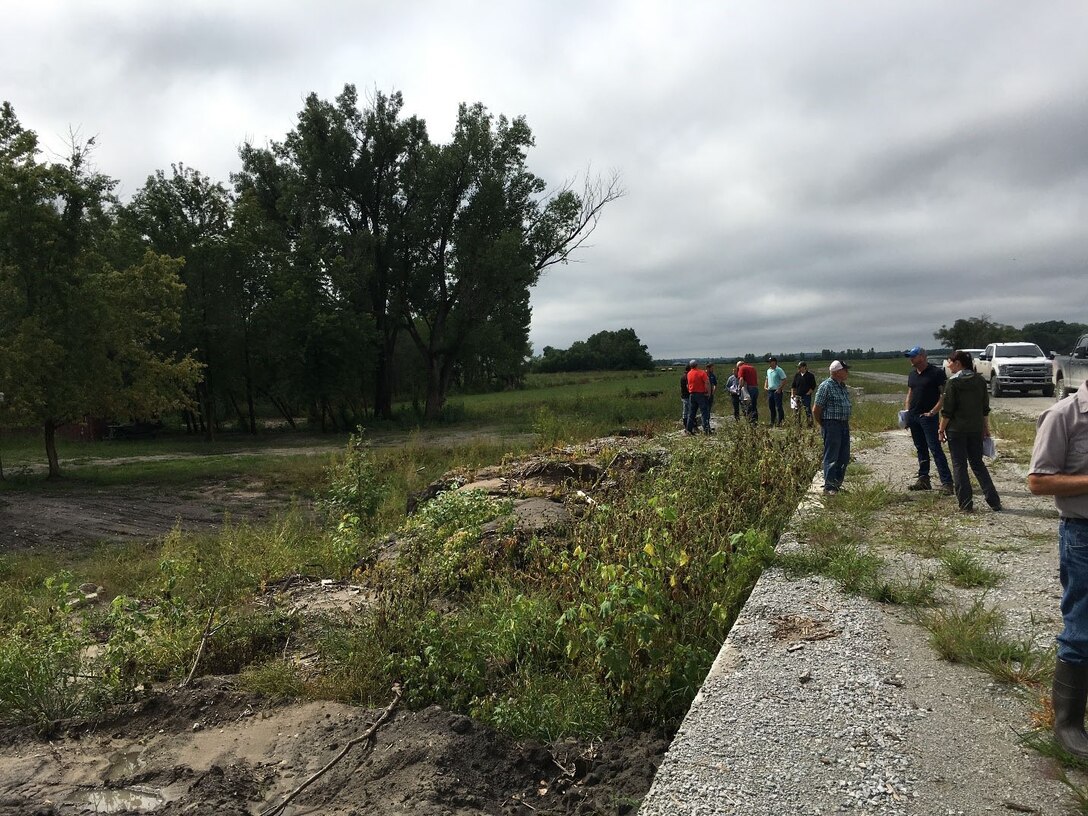 USACE contractors discuss repairs during the pre-bid site visit conducted at Western Sarpy Aug. 28, 2019.