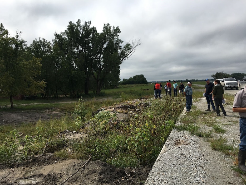 USACE contractors discuss repairs during the pre-bid site visit conducted at Western Sarpy Aug. 28, 2019.