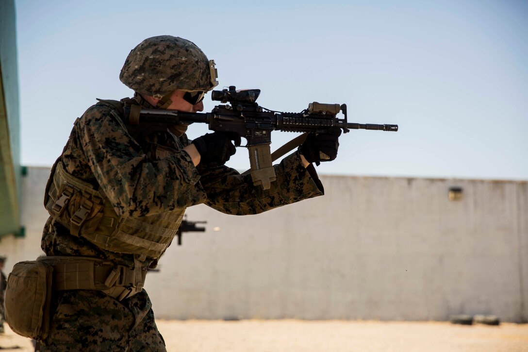 A U.S. Marine with Special Purpose Marine Air-Ground Task Force-Crisis Response-Africa 19.2, Marine Forces Europe and Africa, fires an M4 carbine during a table four range on Moron Air Base, Spain, Aug. 23, 2019.