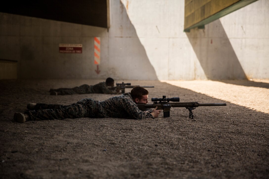 U.S. Marines with Special Purpose Marine Air-Ground Task Force-Crisis Response-Africa 19.2, Marine Forces Europe and Africa, fire an M110 semi-automatic sniper system at Moron Air Base, Spain, Aug. 30, 2019.