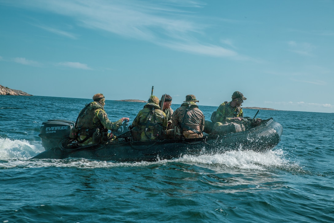 Swedish Marines with Swedish Recce Coy, and U.S. Marines with Scout Snipers Platoon, 1st Battalion, 8th Marines, Marine Rotational Force–Europe 19.2, Marine Forces Europe and Africa,  travel to an objective during an amphibious raid rehearsal as part of Exercise Archipelago Endeavor 19 on an island near Berga Naval Base, Sweden, Aug. 22, 2019