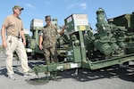 Gunnery Sgt. Michael E. Longoria, 2ND Marine Force Storage Battalion, Marine Force Storage Command, conducts a joint inspection with Mr. James Ogden, disposal service representative, Defense Logistics Agency (DLA) while at Marine Corps Logistics Base Albany, Georgia, August 2019. Marine Corps Logistics Command and DLA are working together to dispose of thousands of obsolete pieces of equipment in support of the Marine Corps’ Equipment Optimization Plan.