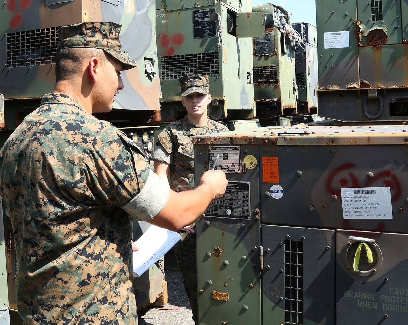 Gunnery Sgt. Michael E. Longoria, left and Sgt. Devin H. McGowan, both assigned to Marine Force Storage Command, inventory generators selected for disposition at Marine Corps Logistics Base Albany, Georgia, August 2019.  The obsolete generators are among the approximately 109,000 pieces of military equipment that Marine Corps Logistics Command will divest or redistribute as part of the Marine Corps’ Equipment Optimization Plan.