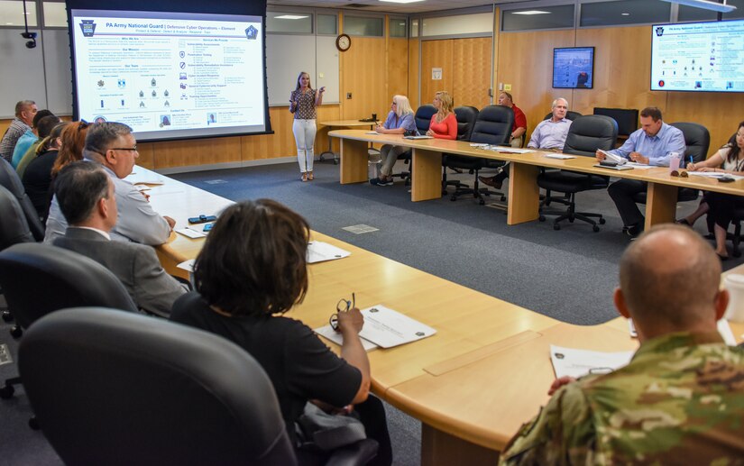 Maj. Christine Pierce briefs members of the Pennsylvania Department of State and Pennsylvania National Guard on cyber security in Harrisburg Aug. 6.