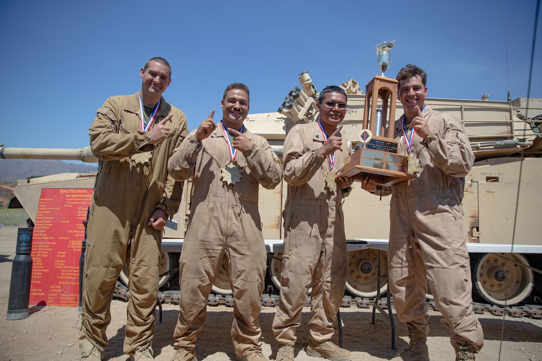 U.S. Marines with 4th Tank Battalion, 4th Marine Division, Marine Forces Reserve celebrate during the TIGERCOMP awards ceremony on Marine Corps Base Camp Pendleton, August 29. TIGERCOMP is an annual force competition that determines the Marine Corps’ most lethal tank crew. The winning crew, 4th Tank Battalion will have the opportunity represent the Marine Corps in the Sullivan Cup, which is the Army’s total force tank gunnery competition.