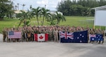 SANTA RITA, Guam (Aug. 30, 2019) Expeditionary forces from Australia, Canada, New Zealand and the United States pose for a group photo during Exercise HYDRACRAB. HYDRACRAB is a quadrilateral exercise conducted by forces from Australia,