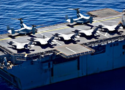 SOUTH CHINA SEA (March 29, 2019) F-35B Lightning II aircraft, assigned to Marine Fighter Attack Squadron (VMFA) 121, and MV-22 Osprey, assigned to Marine Medium Tiltrotor Squadron (VMM) 268, are secured to the flight deck aboard the amphibious assault ship USS Wasp (LHD 1). Wasp, flagship of Wasp Amphibious Ready Group, is operating in the Indo-Pacific region to enhance interoperability with partners and serve as a lethal, ready-response force for any type of contingency.