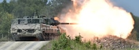 Swedish soldiers with the Wartofta Tank Company, Skaraborg Regiment in a Stridsvagn 122 main battle tank conduct the defensive operations lane during the Strong Europe Tank Challenge, June 7, 2018.