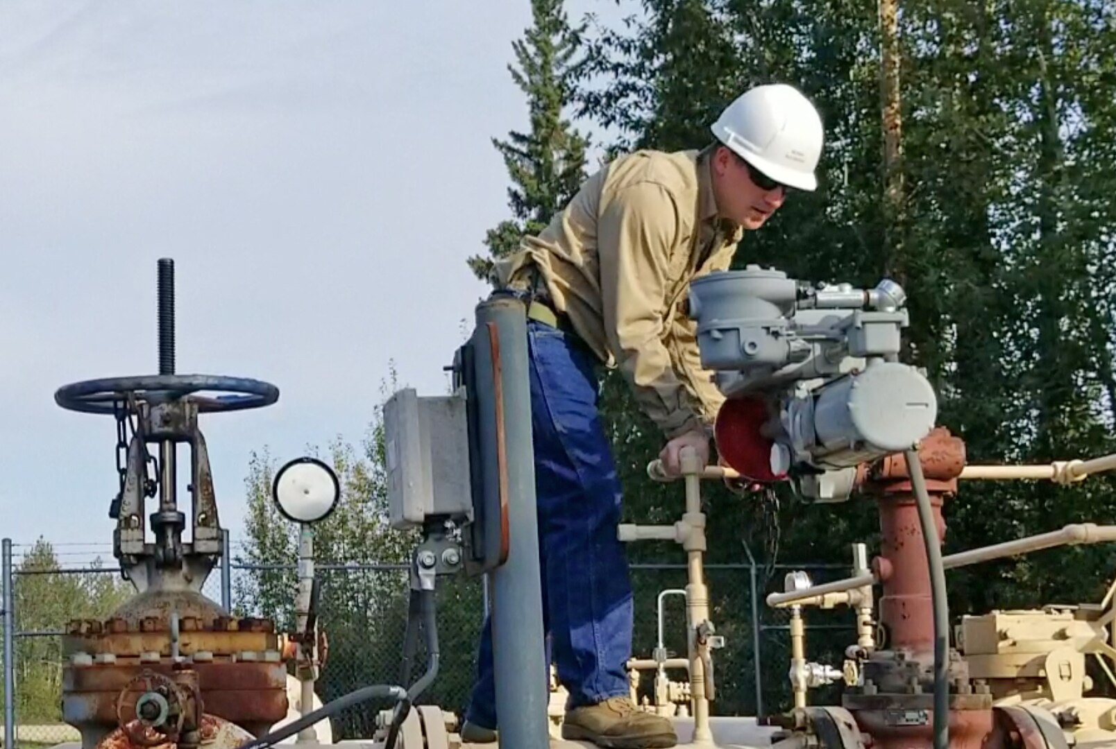 man checks a fuel pipeline