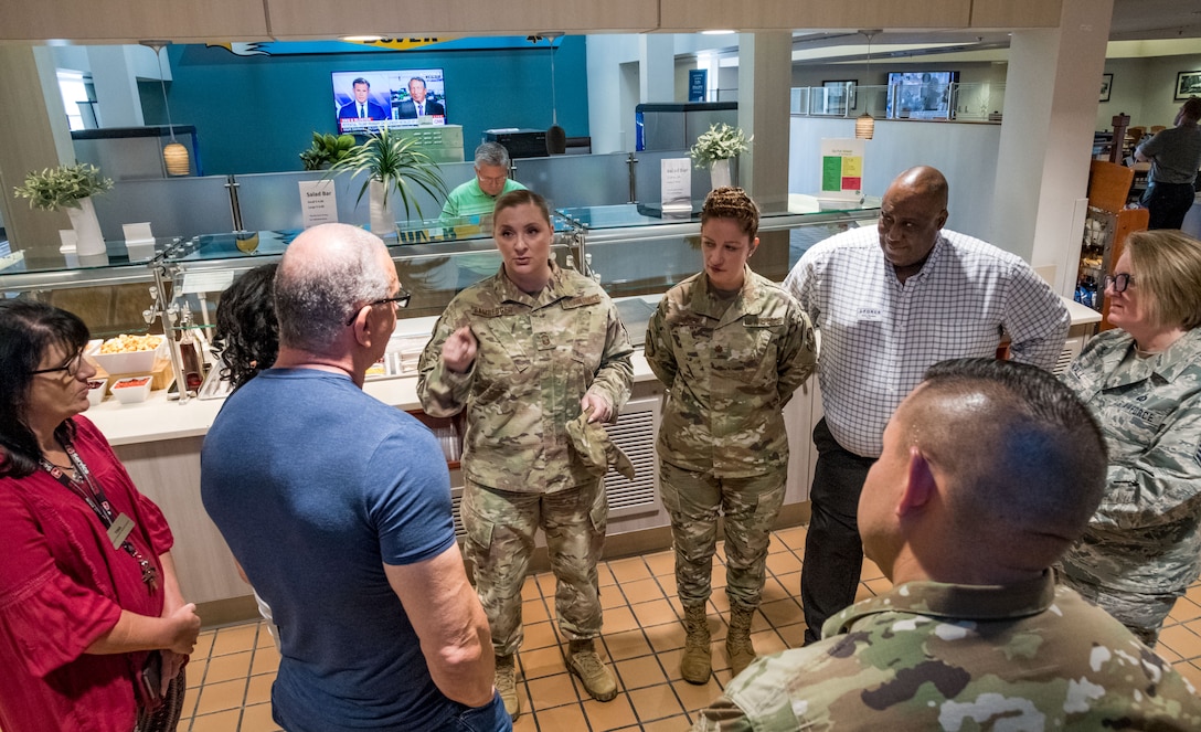 Senior Master Sgt. Kristen Bamberger, 436th Force Support Squadron sustainment services flight superintendent, talks with chef Robert Irvine, Aug. 27, 2019, at the Patterson Dining Facility on Dover Air Force Base, Del. Irvine was briefed on the operation of the facility and its menu selections. (U.S. Air Force photo by Roland Balik)