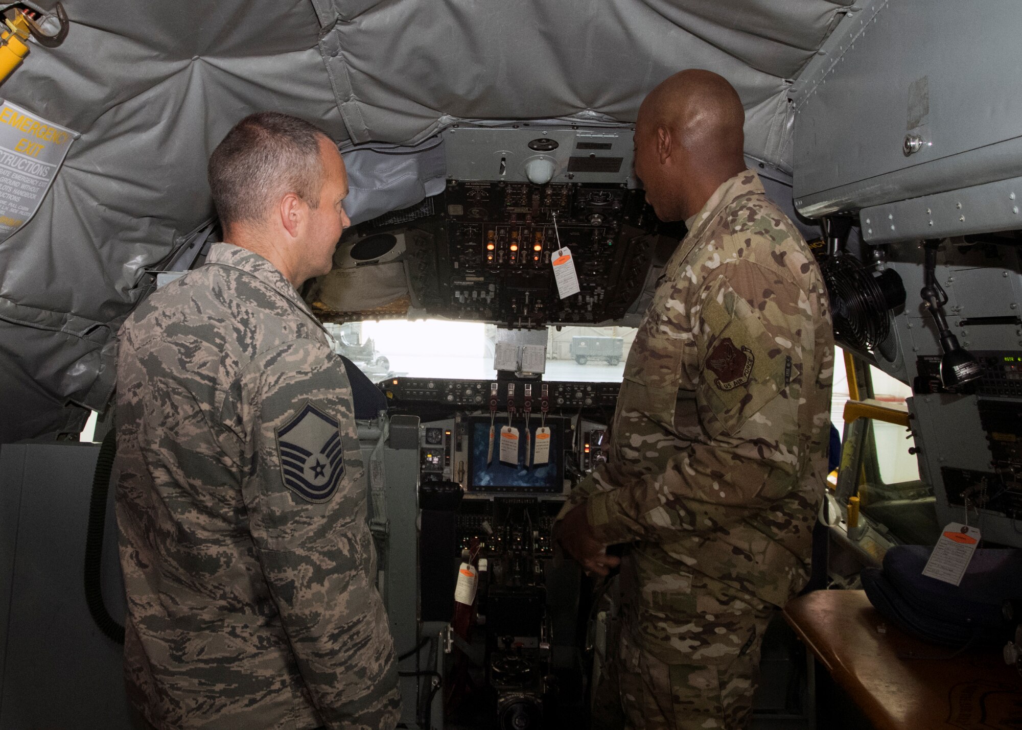 Master Sergeant James Roe, 459th Maintenance Squadron, inspection section supervisor, shows Chief Master Sgt. of the Air Force Kaleth O. Wright the cockpit of a KC-135 Stratotanker while visiting Airmen in the 459th Maintenance Group Aug. 12, 2019 at Joint Base Andrews, Md. During his visit, Wright was shown a KC-135 Stratotanker by members of the 459th MXG in addition to holding an all call where he addressed issues happening in today’s Air Force. (U.S. Air Force photo by Staff Sgt. Cierra Presentado/Released)