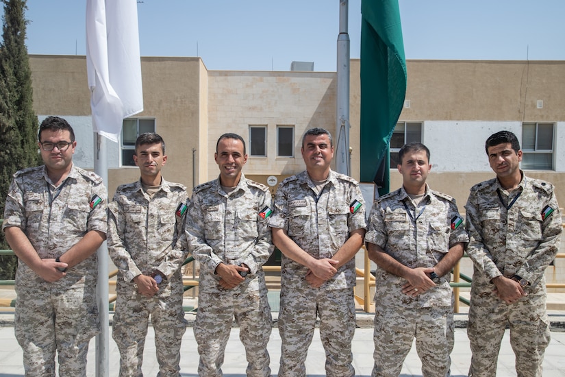 Jordan Armed Forces Maj. Esaid Feras (third from right), the cyber security officer for Eager Lion 19, and members of the JAF Cyber Incident Response Team pose for a photo Sept. 1, 2019, at the King Abdullah II Special Operations Training Center in Amman, Jordan. The cyber portion of EL19 was at its most robust this year.