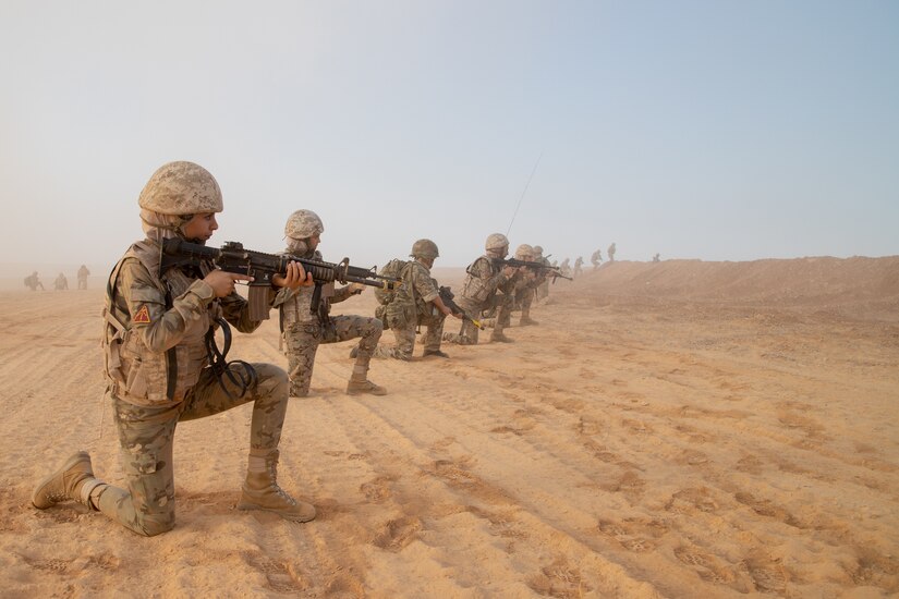 Jordan Armed Forces service members from the Mohamed Bin Zayed Brigade/Quick Reaction Force Female Engagement Team, stop and provide security, while moving towards their objective during a coalition situational training exercise lane during Exercise Eager Lion 19, near Amman, Jordan on Sept. 3, 2019. The JAF FET were integrated into the JAF 81st Rapid Intervention Battalion alongside with the 3 Parachute Regiment, 3rd Battalion.