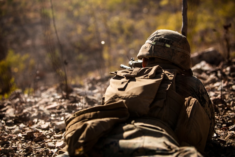 A U.S. Marine fires a round during a platoon attack as a part of Exercise Koolendong at Mount Bundey Training Area, NT, Australia, Aug. 22.