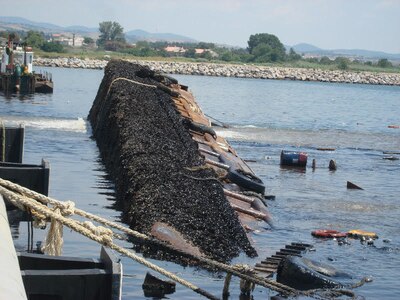 Dredge Barge Olga lays sunken in Harbor