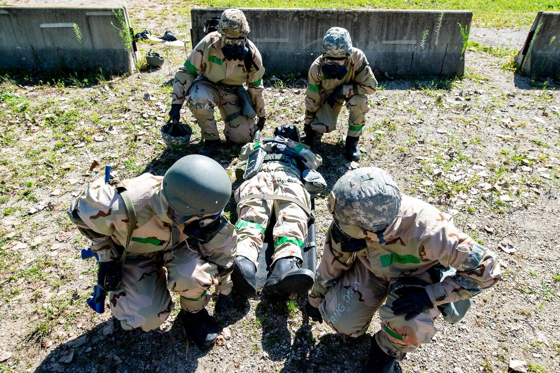 88th Air Base Wing Airmen move a simulated casualty during Base Expeditionary Skills Training at the War Fighters Training Area here Aug. 29. (U.S. Air Force photo/Wesley Farnsworth)