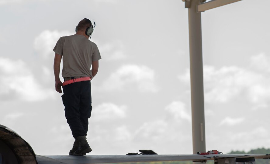 A U.S. Air Force Airmen from the 20th Fighter Wing inspects the wing of an F-16 Viper before Hurricane Dorian’s arrival at Shaw Air Force Base, South Carolina, Sept. 3, 2019.