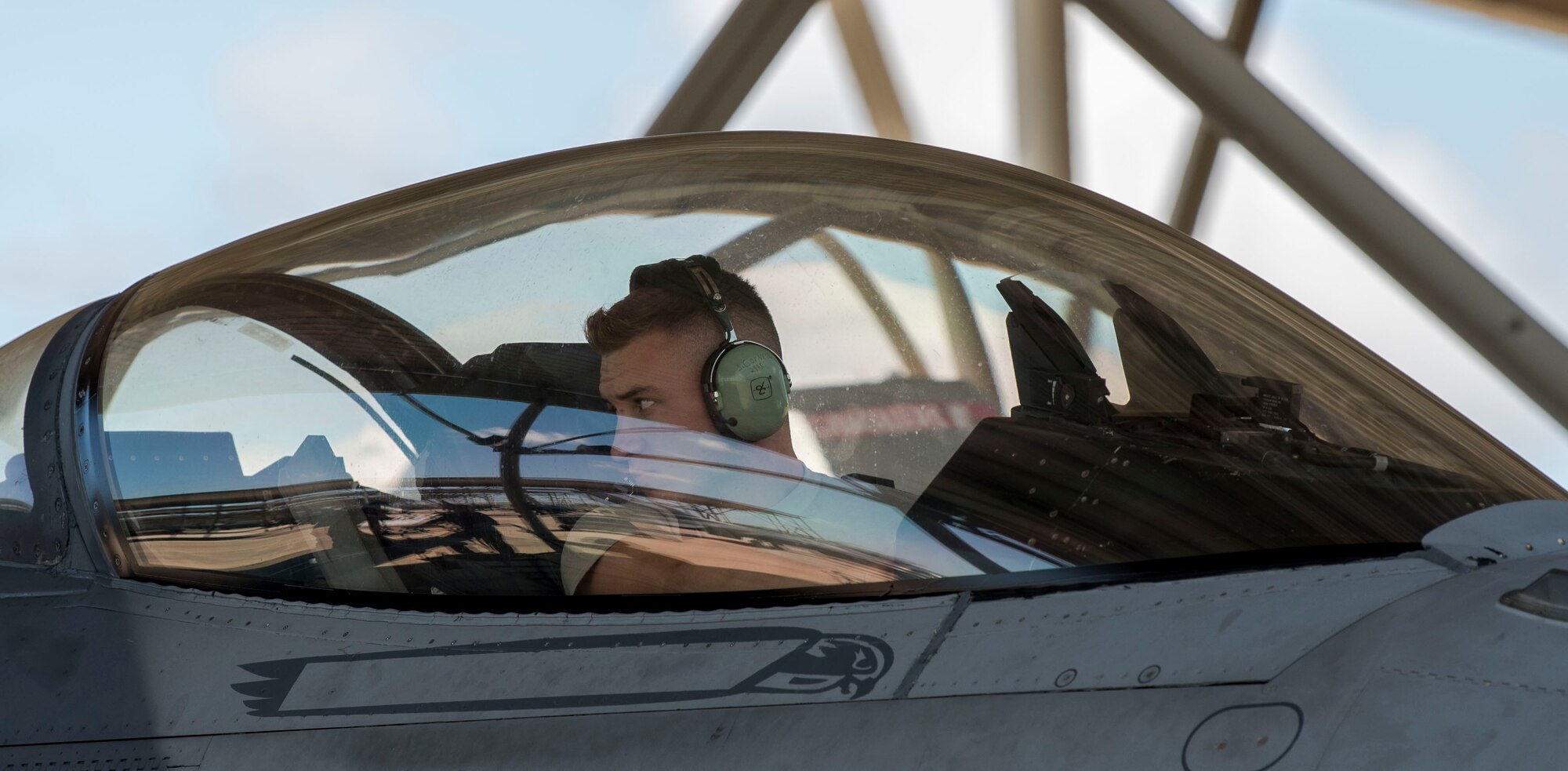 A U.S. Air Force Airmen from the 20th Fighter Wing inspects the wing of an F-16 Viper before Hurricane Dorian’s arrival at Shaw Air Force Base, South Carolina, Sept. 3, 2019.
