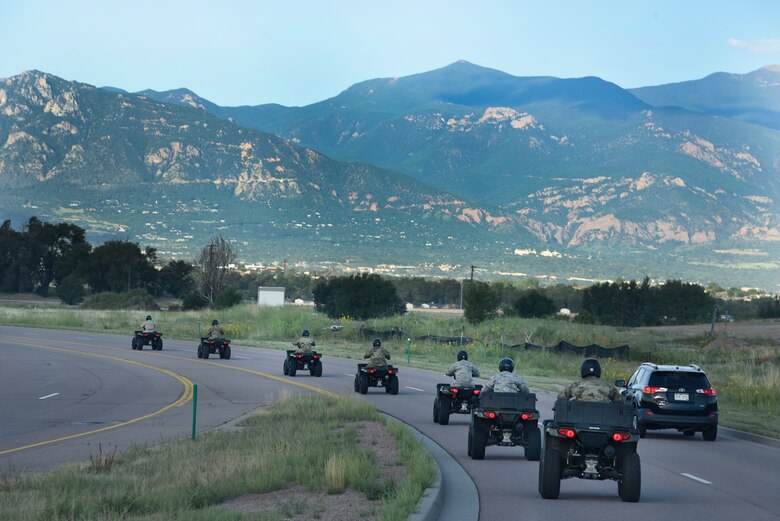 Col. Thomas Falzarano, 21st Space Wing commander, drives an all-terrain vehicle on the perimeter of the base to understand installation jurisdiction, base boundaries, securities, demarcation lines, access control points, sentry duties and installation defense August 16, 2019 at Peterson Air Force Base, Colorado. ATVs are the easiest way for security forces to navigate along the perimeters of Peterson AFB and Cheyenne Mountains AFS, as well as other areas where terrain is rougher than normal. (U.S. Air Force photo by Staff Sgt. Alexandra M. Longfellow)