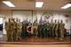 U.S. Airmen pose for a photo with U.S. Air Force Gen. Mike Holmes, commander of Air Combat Command, at Davis-Monthan Air Force Base, Arizona, Aug. 21, 2019. Holmes personally recognized the Airmen who aided in the rescue of two crewmembers of the Tamar, a Slovenian-owned ship damaged by an explosion in 2017. (U.S. Air Force photo by Senior Airman Mya M. Crosby)