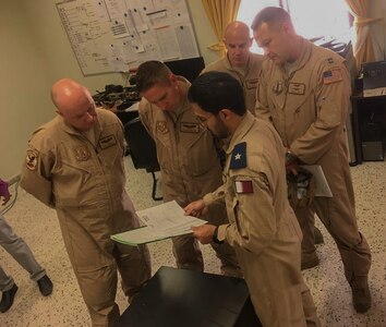 Members of the West Virginia Air National Guard's 130th and 167th Airlift Wing discuss current operations planning and procedures with representatives of the Qatari Emiri Air Force Aug. 17., 2019, at Al Udeid Air Base, Qatar. The subject matter expert exchange was the second WVANG-QEAF partnership meeting to be held since the announcement of the new partnership in May 2018, which marked the second partner nation for the WVNG and the sixth SPP country in the U.S. Central Command area of responsibility for the National Guard. (Courtesy photo)