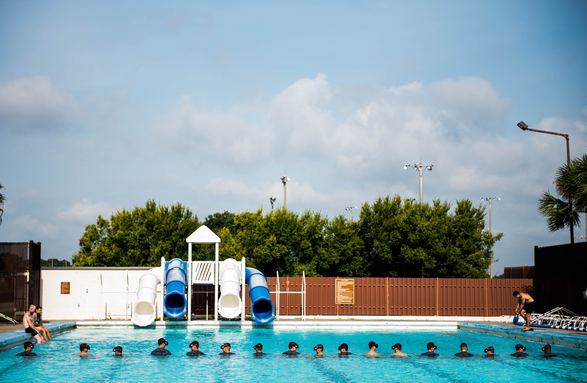 Special Warfare training students from the 352nd Special Warfare Training Squadron participate in a memorial physical training session at the Triangle Pool on Keesler Air Force Base, Mississippi, Aug. 9, 2019. The PT event was in memory of U.S. Air Force Staff Sgt. Andrew Harvell, combat controller, who was killed in action on Aug. 6, 2011. Special Warfare trainees attend combat controller and special reconnaissance courses in the 334th and 335th Training Squadrons. (U.S. Air Force photo by Sarah Loicano)