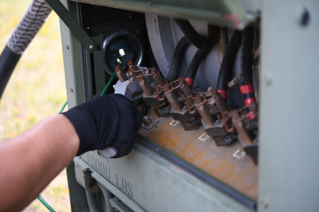 Seymour Johnson Air Force Base, N.C. — Senior Airman Louis Rivers, 4th Civil Engineer Squadron pavement and production specialist, performs generator maintenance Sept. 4, 2019, at Seymour Johnson Air Force Base, North Carolina. The 4th CES, to include equipment operators, electricians, plumbers, structural craftsman, heating, ventilation and air conditioning, and production technicians, are providing 24-hour response and recovery operations during and following Hurricane Dorian. (U.S. Air Force photo by Staff Sgt. Michael Charles)