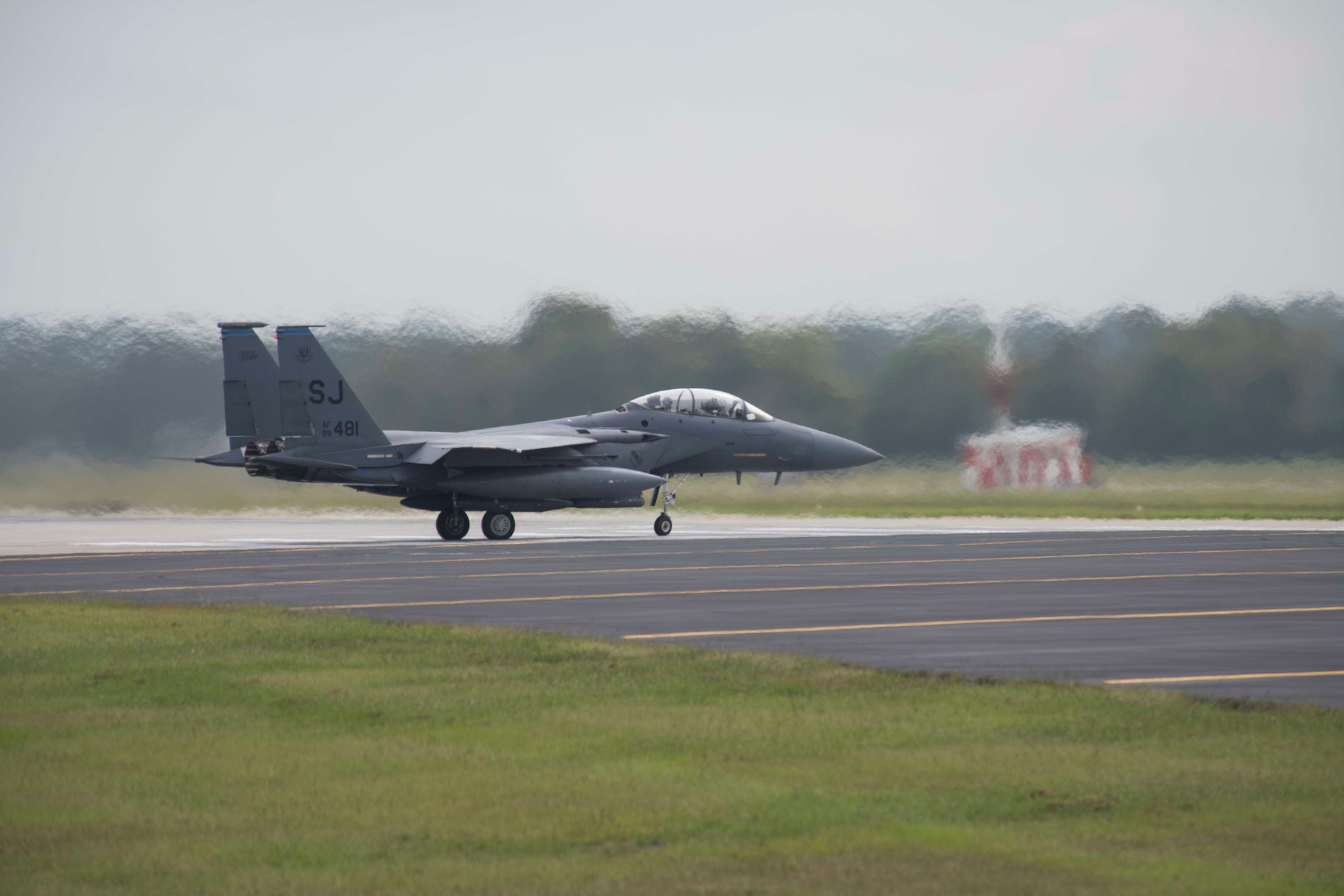 An F-15E Strike Eagle prepares to takeoff during a repositioning in advance of Hurricane Dorian, September 4, 2019, at Seymour Johnson Air Force Base, North Carolina. More than 30 aircraft were repositioned to Tinker AFB, Oklahoma, as a precautionary measure to avoid severe weather associated with Hurricane Dorian. (U.S. Air Force photo by Senior Airman Kenneth Boyton)