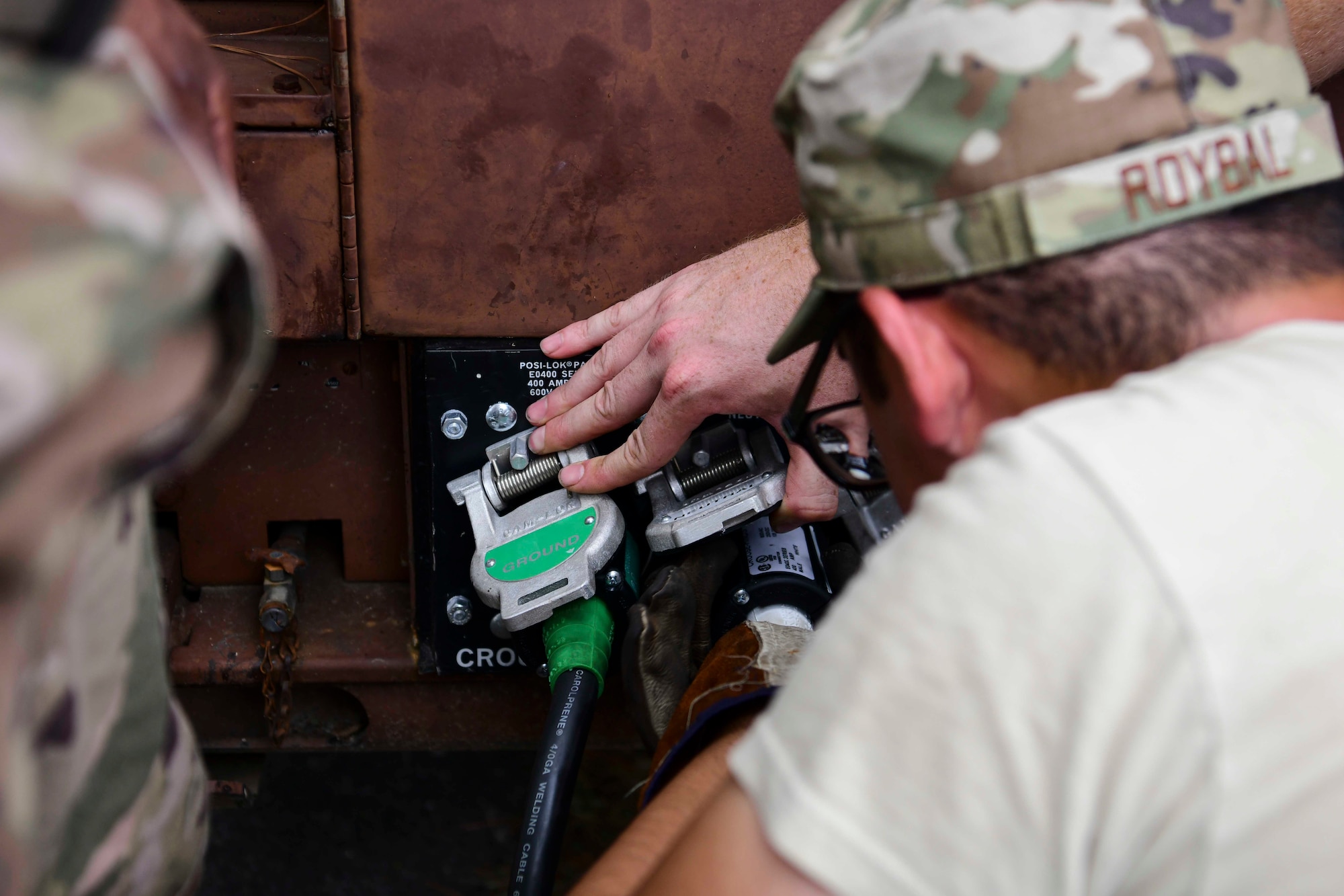 Senior Airman Fred Roybal, 4th Civil Engineer Squadron power and production journeyman, connects electrical lines to a generator ahead of Hurricane Dorian Sept. 4, 2019, at Seymour Johnson Air Force Base, North Carolina. The 4th CES, to include equipment operators, electricians, plumbers, structural craftsman, heating, ventilation and air conditioning, and production technicians, are providing 24-hour response and recovery operations during and following Hurricane Dorian. (U.S. Air Force photo by Senior Airman Boyton)