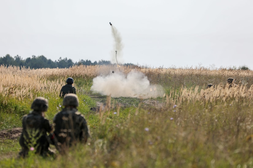 Soldiers fire line charge.