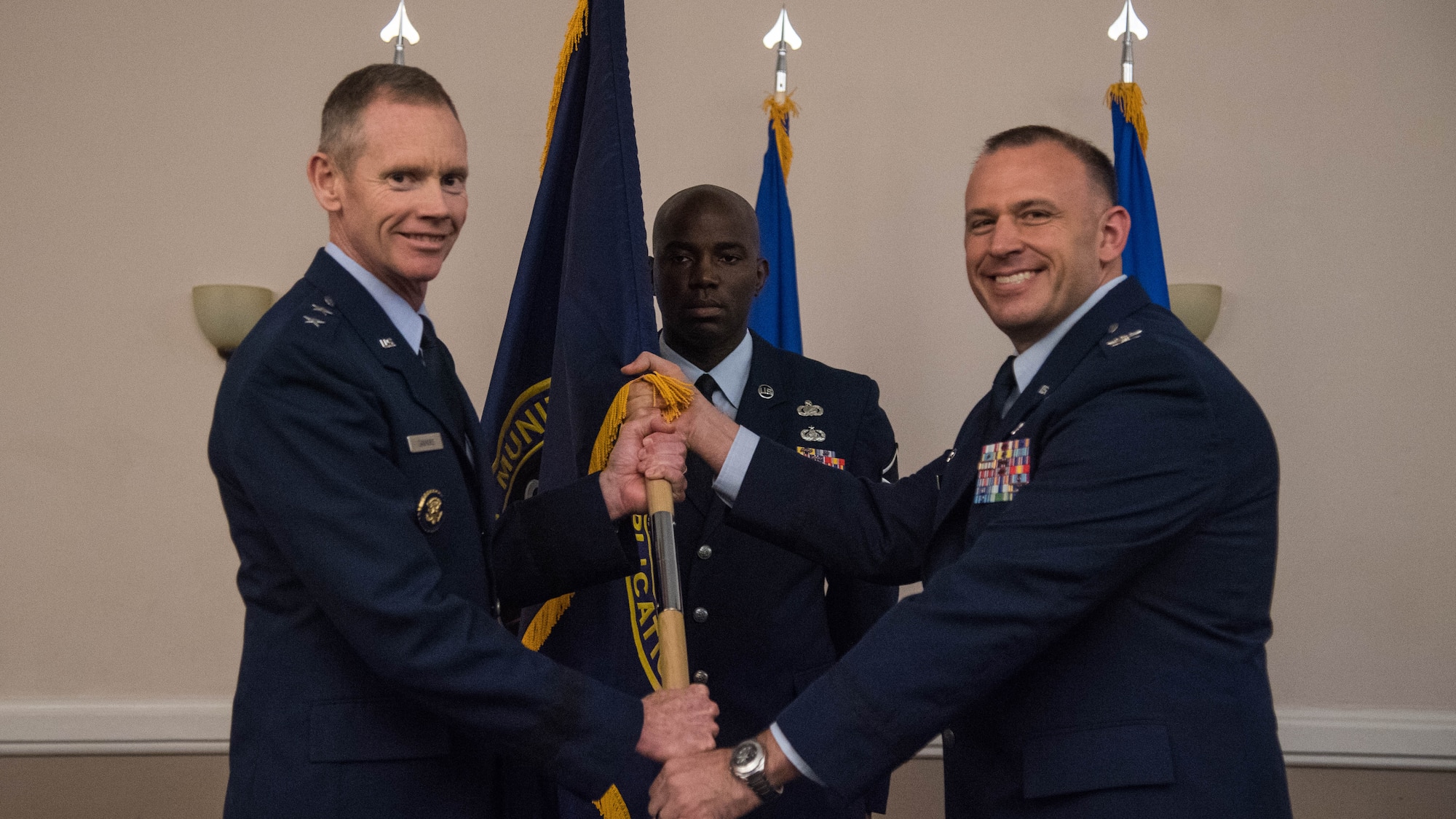 Col. Matthew W. McDaniel, right, incoming Standoff Munitions Application Center commander, receives the guidon from Maj. Gen. James C. Dawkins Jr., left, 8th Air Force and Joint-Global Strike Operations Center commander, during an assumption of command ceremony at Barksdale Air Force Base, Louisiana, August 9, 2019. SMAC is a mission planning cell within the J-GSOC that focuses on standoff weapons routing. The unit was activated Aug. 24, 2018. (U.S. Air Force photo by Airman Jacob B. Wrightsman)