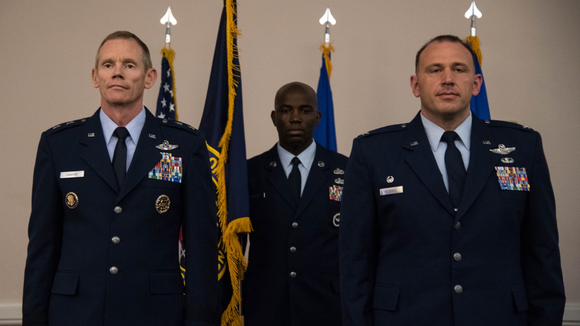 Maj. Gen. James C. Dawkins Jr., left, 8th Air Force and J-GSOC commander, and Col. Matthew W. McDaniel, right, Standoff Munitions Application Center commander, stand at attention during an assumption of command ceremony at Barksdale Air Force Base, Louisiana, August 9, 2019. The SMAC is an integrated initiative in charge of building up standoff weapon capabilities across the Department of Defense. (U.S. Air Force photo by Airman Jacob B. Wrightsman)