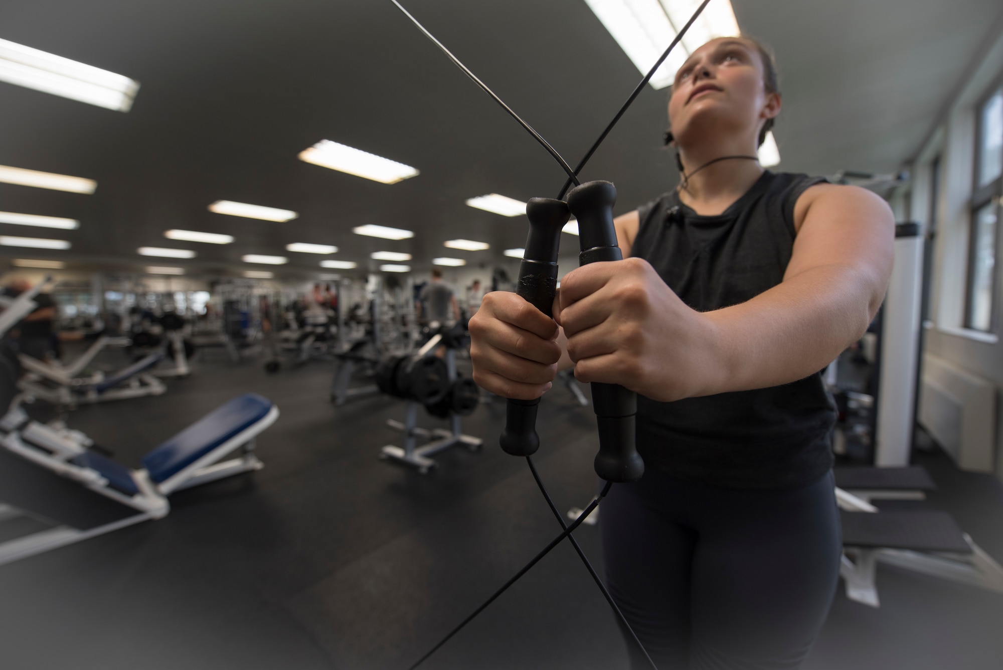 U.S. Air Force Senior Airman Sidnea Bailey, a 35th Operations Support Squadron aircrew flight equipment journeyman, uses a cable crossover machine at Potter Fitness Center, at Misawa Air Base, Japan, Aug. 11, 2019. Prior to introducing fitness into her life Bailey felt lonely, depressed and unsure of her future, however lifting weights and pushing herself to be physically active has combatted those negative feelings. (U.S. Air Force photo by Senior Airman Collette Brooks)