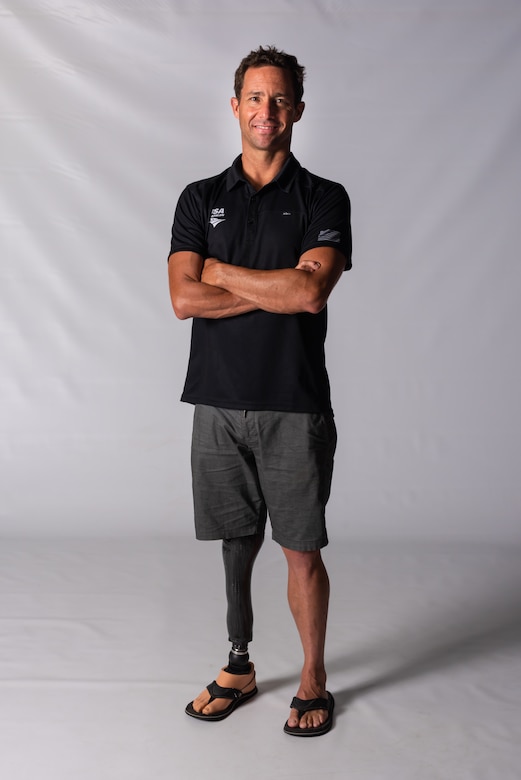 Jamie Brown, U.S. Paratriathlon National Team elite paralympic athlete, poses for a photo Aug 13, 2019, on Kadena Air Base, Japan. Brown was born with a congenital birth defect known as fibular hemimelia, which led him to have his foot amputated and his fingers separated when he was a child. (U.S. Air Force photo by Senior Airman Cynthia Belío)
