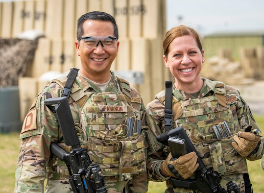 Chief Master Sgt. Kathi Glascock, 100th Air Refueling Wing command chief, and Col. Troy Pananon, 100th ARW commander, pose for a photo while participating in 100th Security Forces Squadron’s advanced shoot, move and communicate training Aug. 30, 2019, on RAF Mildenhall, England. The 100th ARW command team makes a point of getting out around base and visiting Airmen, getting a taste of the work they do and talking with them to ask and answer questions they may have. (U.S. Air Force photo by Senior Airman Luke Milano)