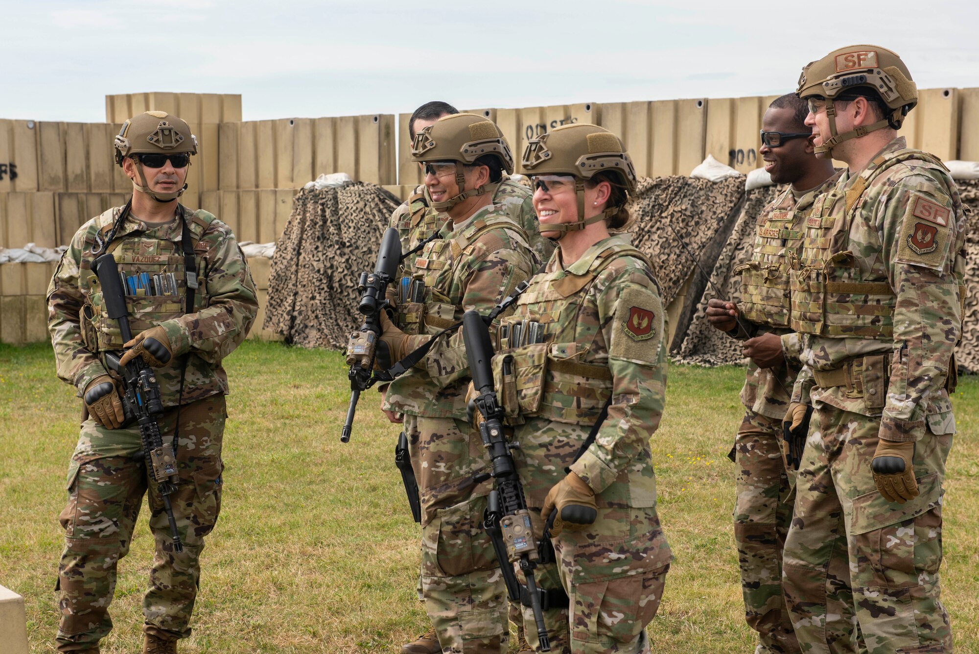 Chief Master Sgt. Kathi Glascock, center, 100th Air Refueling Wing command chief, and Col. Troy Pananon, second left, 100th ARW commander, observe and participate in 100th Security Forces Squadron’s advanced shoot, move and communicate training Aug. 30, 2019, on RAF Mildenhall, England. Glascock arrived at RAF Mildenhall in June 2019 and has hit the ground running, getting out to work centers around base, meeting Airmen and talking with them to see what issues they may have and how she can help make their lives better. (U.S. Air Force photo by Senior Airman Luke Milano)
