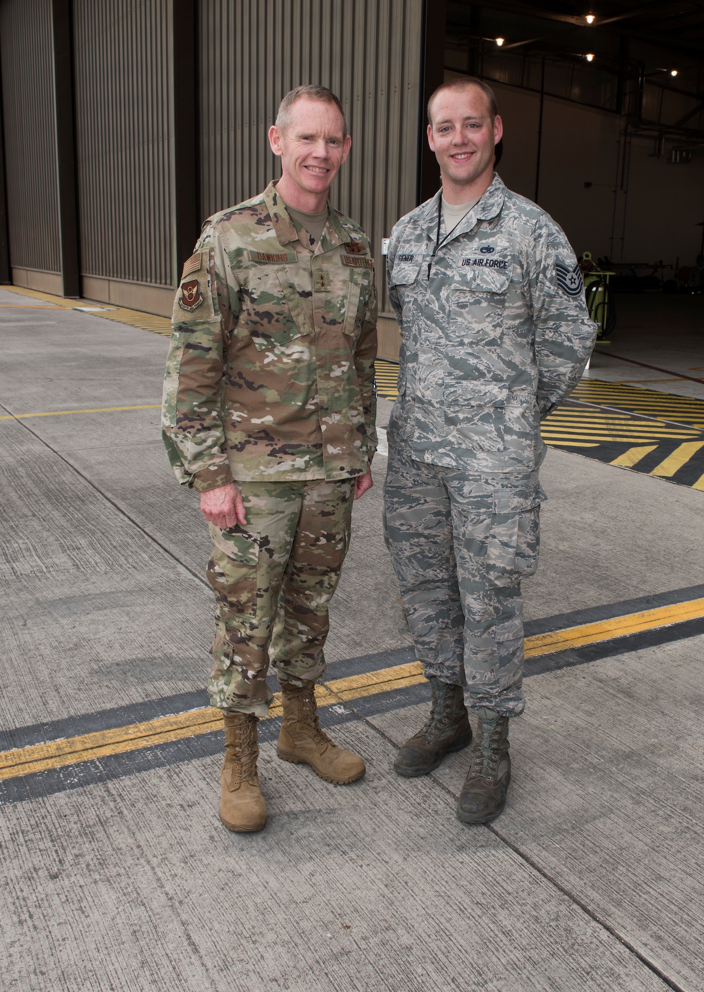 Major General James Dawkins Jr., Eighth Air Force commander, poses for a photo with Technical Sergeant Erik Riener, an aerospace ground equipment member assigned to the 509th Aircraft Maintenance Squadron at Whiteman Air Force Base, Missouri, on August 27, 2019, at Royal Air Force Base Fairford, England. Riener and other members of Team Whiteman, along with along strategic partners have deployed as part of a Bomber Task Force to the European Command area of operations to conduct theater integration and flying training. (U.S. Air Force photo by Staff Sgt. Kayla White)