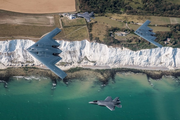 A U.S. Air Force B-2 Spirit, currently deployed to RAF Fairford in Gloucestershire, England, flies above the English countryside near Dover with two RAF F-35 jets, August 30, 2019. This is the first time UK F-35 Lightening jets have conducted training with the U.S. B-2 stealth bomber. (Courtesy Photo)